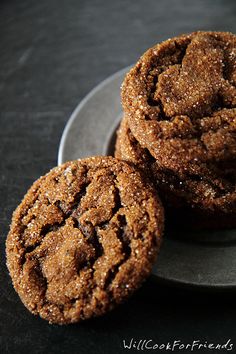 three cookies on a plate with one cookie in the middle