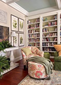 a living room filled with lots of furniture and bookshelves