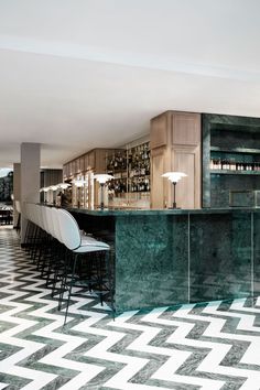 the bar is decorated with green marble