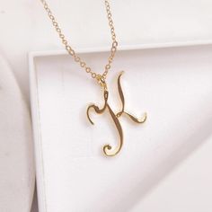 K Initial Necklace - Cursive "K" initial gold pendant necklace - Monogram necklace for women - Personalized gold Initial necklace for her Dainty "K" initial. Perfect every day necklace. Lovely gift for your self, sister, bridesmaids, new mom. Pendant: Base metal is brass and 14K gold plated. Chain is 18 inches, 14k gold filled.  Note: model shots might show a different initial, only to illustrate overall look and length of the chain. This listing is for the "K" initial. Luxury Initial Pendant Jewelry With Name Detail, Cheap Initial Pendant Necklaces With Letter Print, Luxury Initials Pendant Jewelry, Cheap Initial Pendant Jewelry With Chain, Luxury Initials Name Necklace For Personalized Gift, Luxury Initial Pendant Necklace For Formal Occasions, Cheap Initial Necklaces For Birthday Gift, Luxury Classic Initial Pendant Jewelry, Luxury Initials Necklace For Gift