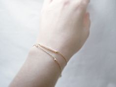 "Double strand beaded bar bracelet - dainty jewelry Tiny baby pink beads beaded on 14K gold filled chain. Double chain bracelet that's femininely dainty in soft shades of gold and blushing pink. measurements bead bar length 1\" please choose length at checkout ♦you can enter shop here! http://etsy.com/shop/illusy" Minimalist Beaded Bracelets With Satellite Chain For Everyday, Adjustable Delicate 14k Gold Beaded Bracelet, Delicate Adjustable 14k Gold Beaded Bracelet, Minimalist Gold Beaded Bracelets, Dainty Adjustable Chain Bracelet, Delicate Gold Bracelet With Satellite Chain For Everyday, Dainty Yellow Gold Beaded Bracelets In 14k Gold Filled, Minimalist Everyday Beaded Bracelet With Delicate Chain, Delicate Bracelets With Tiny Beads