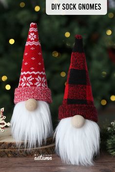 two knitted gnomes sitting next to each other