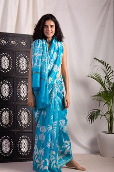 An alluring screen print of leaf motifs in white and blue on the gorgeous Bengal Silk Saree. The softest silk, that is easy to drape and can be worn in all seasons due to its rare qualities. The saree comes with a coordinating blue blouse. Saree Collection, Blue Blouse, Silk Saree, Screen Print, Silk Sarees, Screen Printing, Blue And White, Saree