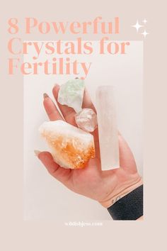 a person's hand holding three crystals with the text 8 powerful crystals for fertility