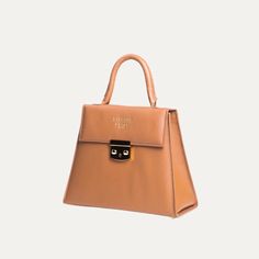 Introducing The Francis, a timelessly chic bag handcrafted with supreme care. Featuring luxurious Saffiano leather, hand stitched details, and a solid brass lock, it's a stylish statement piece that you can carry in comfort and ease. Leather Cleaner, Unique Top, Best Wallet, Chic Bags, Leather Interior, Handcrafted Leather, Hand Stitched, Hand Stitching, Bucket Bag