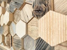 the wooden wall is made up of many different types of hexagonal shapes and sizes