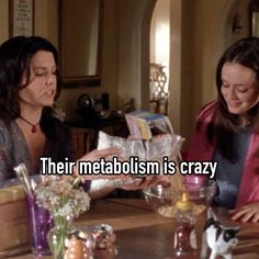 two women sitting at a table with food in front of them and the caption reads, their metabolism is crazy