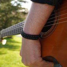 Feel strong and stylish with this cool black onyx bracelet named "Raven's Shadow". The leather cord adds a rugged touch to your look. Perfect for anyone who wants to stand out with a touch of class. ⚠️ Please note that there are 2 variations of this bracelet. One is for wrist sizes of 17.7 cm-18.3 cm (6.97 in-7.2 in), and the other is for wrist sizes of 18.4 cm-19 cm (7.24 in-7.48 in). The model in the picture has a wrist size of 18.3 cm (7.2 in). Please choose the correct size when placing your Adjustable Black Rock Bracelet, Black Rock Style Bracelet For Gift, Black Rock Style Wristband As Gift, Beaded Leather Bracelet, Leather Cord Bracelets, Black Birthday, Black Onyx Bracelet, Onyx Bracelet, Men's Bracelet