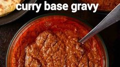 two bowls filled with curry next to some pita bread on a table and the words curry base gravy above them