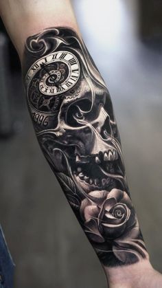 a man's arm with a clock and skull tattoo on it