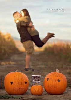 a couple kissing in front of pumpkins with the words our wedding is bumppaid written on them