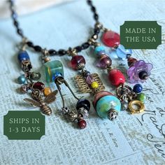 This Colorful Recycled Bead Necklace features whimsical boho charms in eclectic dark rainbow colors. A unique handmade gift, it's an ideal choice for your spouse or sister. 𝗗𝗘𝗧𝗔𝗜𝗟𝗦 🍂 Measures 25 and 1/2 inches is length 🍂 Strung on strong 49 strand professional beading cable 🍂 American brass fold over hinge clasp; fastens on side 🍂 Upcycled Czech glass, acrylic flower, chain, working safety pin, clasp, and more 🍂 Vintage wood bell bead, USA brass bee charm, mixed metal beads 🍂 Czech glass is a mix of colors and shapes 🍂 One of a kind gift; don't miss out! 𝗛𝗢𝗪 𝗧𝗢 𝗢𝗥𝗗𝗘𝗥 1: Select item quantity 2: Select options, if applicable 3: Add to cart 4: Choose shipping method 𝗬𝗢𝗨 𝗔𝗟𝗦𝗢 𝗠𝗜𝗚𝗛𝗧 𝗟𝗜𝗞𝗘 Lever Back Earrings: https://www.etsy.com/shop/creationsbytara/?ets Boho Charms, Dark Rainbow, Mix Jewelry, Flower Chain, Acrylic Flower, Gift For Sister, Bee Charms, Acrylic Flowers, Matching Jewelry