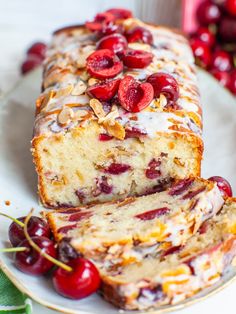 a loaf of cherry almond bread on a plate