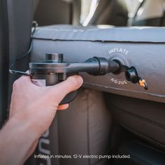 someone is adjusting the controls on their car's steering wheel knobs and seat belt