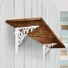 a wooden shelf with white lace on it