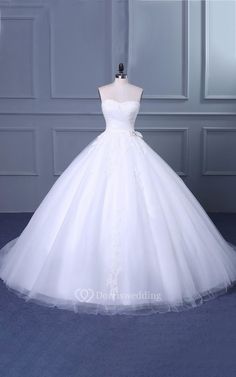 a white wedding dress on a mannequin