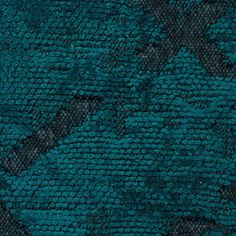 a close up view of the blue and black textured material that is used for carpeting