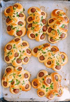 hot dogs with cheese and pepperoni are on a baking sheet, ready to be baked