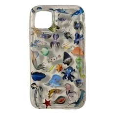 A transparent phone case featuring 3D images of marine creatures like jellyfish, fish, and starfish, creating a striking and colorful design - boogzel clothing Underwater Phone Case, Aesthetic Case Ideas, Whimsigoth Phone Case, Domo Phone Case, Chunky Phone Case, Iphone 15 Case, Surfer Phone Case, Decorating Phone Case, Punk Phone Case