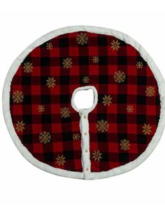 a red and black plaid christmas tree skirt with snowflakes on the bottom,