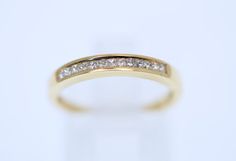 Absolutely Stunning Hand Made Channel Set Engagement Dress Band Ring.Made in Solid 18K Yellow Gold Ring Channel Set with Natural Diamond Princess Cut in total 0.30CtAll diamonds are SI1 clarity, G color in 2.8mm wide band Ring Size 6 US  or L (UK/AU) 2.35GramsMetal: 18k Solid Gold (Marked, and Professionally Tested)Stamped;750 Condition:Pre-OwnedThe ring is in Very Good Condition(any dark marks on the gold in the photos are only reflections)Ring Come with New  Luxury Wooden Box (different as in Luxury Wooden Boxes, Diamond Princess, Engagement Dress, Stackable Bands, Dark Mark, Band Jewelry, 18k Yellow Gold Ring, Wide Band Rings, Channel Set