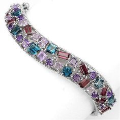 Metal Information: .925 Sterling Silver Setting: Prong Item: Bangle Finish: Rhodium Plated Metal Stamp: 925 Total CTW: 103 28 Carat Bracelet Size: 2.2 Width: 24 mm Stone Information: AMETHYST, RHODOLITE GARNET, LONDON BLUE TOPAZ & IOLITE Shape: OCTAGON, SQUARE & ROUND FACET Stone Size: 3.0 TO 5.0 X 3.0 MM. THIS IS FINE JEWELRY ZirconZ Are High Quality Cubic Zirconia's NEVER BUY A DIAMOND AGAIN PLEASE NOTE: ALL PICTURES ARE CROPPED TO BRING IN DETAILS. Please refer to my sizes listed. ALL Sterling Silver Gemstone Bracelet, Sterling Silver Fine Jewelry Bracelets With Stones, Sterling Silver Multi-stone Bracelets, Formal Sterling Silver Bracelets With Gemstone Accents, Luxury Sterling Silver Bracelets With Stones, Sterling Silver Bracelet With Gemstone, Sterling Silver Gemstone Bangle Bracelet, Fine Jewelry Sterling Silver Gemstone Bangle, Sterling Silver Bracelets With Gemstone Accents For Anniversary