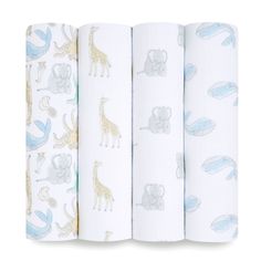 three baby swaddles with animals and giraffes on them, all lined up