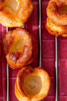 several pastries sitting on top of metal racks