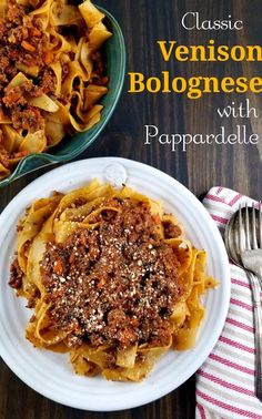 a plate of pasta with meat and sauce on it next to a bowl of noodles