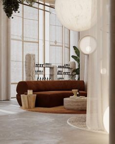 a living room filled with lots of furniture and large white balls hanging from the ceiling