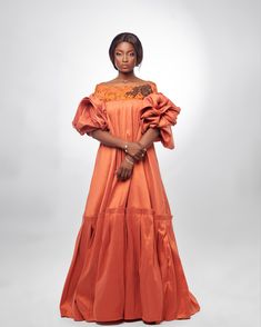 She’s a queen to be… Regal and elegant, this take on a traditional kaba is crafted in taffeta and embellished with a lace trim. The kaba is the traditional dress from the South-West and Littoral provinces of Cameroon, West Africa which has captured the imagination of international designers like Stella McCartney. Product Details Maxi ruffle Composition Taffeta Care Dry clean only Made in Cameroon, West Africa Fitted Embellished Dress For Traditional Ceremonies, Traditional Dresses With Fitted Bodice For Evening, Taffeta Evening Dress, Floor-length, Elegant Organza Dress With Embroidered Sleeves, Traditional Organza Dress For Ceremonies, Traditional Silk Evening Dress, Couture Organza Dress With Ruffles, Fitted Organza Dresses With Embroidered Sleeves, Embellished Taffeta Dresses For Wedding