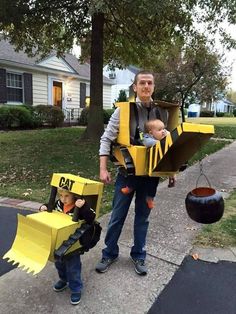 a man and child wearing costumes made to look like construction workers