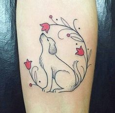 a tattoo with a dog on it's thigh and flowers around the leg area