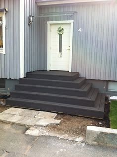 steps leading up to the front door of a house