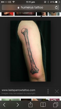 a tattoo with a long bone on the arm