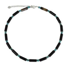 Polished rods of onyx host sky blue globes in a necklace of dramatic contrast. Adding diminutive beads of sterling silver Somluck Komolmith creates a beautiful choker that adjusts in length. .925 Sterling silver Adjustable Onyx Choker Necklace, Adjustable Hand-strung Onyx Necklace, Paw Print Jewelry, Beautiful Chokers, Ribbon Jewelry, Silver Bead Necklace, Printed Jewelry, Onyx Bead, Latest Jewellery