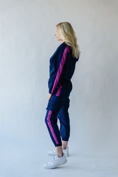 We couldn’t keep something this good to ourselves. These jogger style windbreaker pants our exclusive to us + come in inclusive sizing. They have a thick + flexible waistband with pink stripe down the sides of the legs. Pair with The Dua Windbreaker to make it a set. Details Model is wearing a small self/lining: 100% cotton Fabric Care Guide Here Sizing & Fit Measurements are approximate and taken while laying flat across the front. Not doubled. x-small: waist = 12"; length = 38"; inseam = 27" s