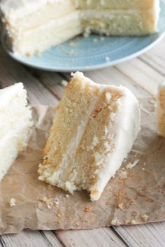 two slices of white cake sitting on top of a piece of paper