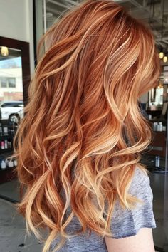 Woman with wavy, multi-toned red hair in a salon. Highlights On Ginger Hair, Copper To Blonde Balayage, Copper To Blonde, Copper With Blonde Highlights, Copper With Blonde, Bold Balayage, Red And Blonde Highlights, Ginger Blonde Hair, Short Copper Hair