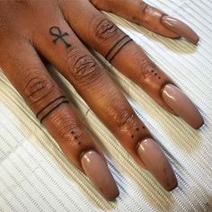 a woman's hand with tattoos on it, and the word love written in cursive writing