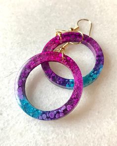 Purple, Turquoise, and Pink Resin Earrings  Handcrafted with resin and nickel free wire hook. These earrings are made to order and can be made with custom colors. These are lightweight and comfortable while delivering a beautiful statement. See the latest from Well Crafted Soul at www.facebook.com/WellCrafted Soul or at www.Instagram.com/allipgh/ Handmade Turquoise Resin Earrings, Multicolor Round Resin Earrings, Turquoise Resin, Turquoise And Pink, Purple Turquoise, Resin Earrings, Resin Jewelry, Alcohol Ink, Statement Earrings