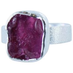 The Sterling Silver and Rough Ruby Ring is a beautiful rough cut piece of vibrant ruby set in a gorgeous sterling silver ring with a contemporary matt finish to the setting and band. This stunning ring is cleverly designed so it can gently adjust.  The combination of the eye popping colour with the contemporary design makes for a very special piece that will be admired by all. Silver does tarnish over time when the surface of the silver reacts with oxygen to create silver oxide which is grey/bla Cleaning Tarnished Silver, Ruby Set, Bracelet Pendant, August Birthstone Jewelry, July Birthstone Jewelry, Matching Bracelet, Gifts For New Mums, Jewelry Ring Box, Pearl Jewellery Earrings