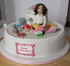 there is a cake with a woman sitting on it