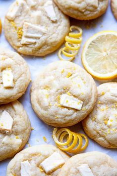 lemon and white chocolate cookies are arranged on a table