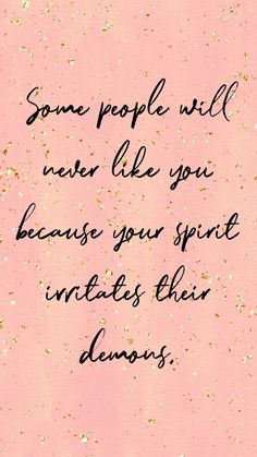 some people will never like you because your spirit inhales their demons quote on pink background