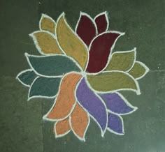 a colorful flower design on the ground