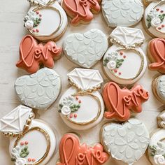 many decorated cookies are arranged on a table