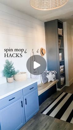 a kitchen with blue cabinets and black and white stripes on the floor is featured in this video