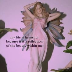 a statue of a woman with wings in front of a pink background that says, my life is beautiful because it's a reflection of the beauty within me