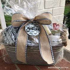 a basket filled with cookies and marshmallows on top of a brick walkway